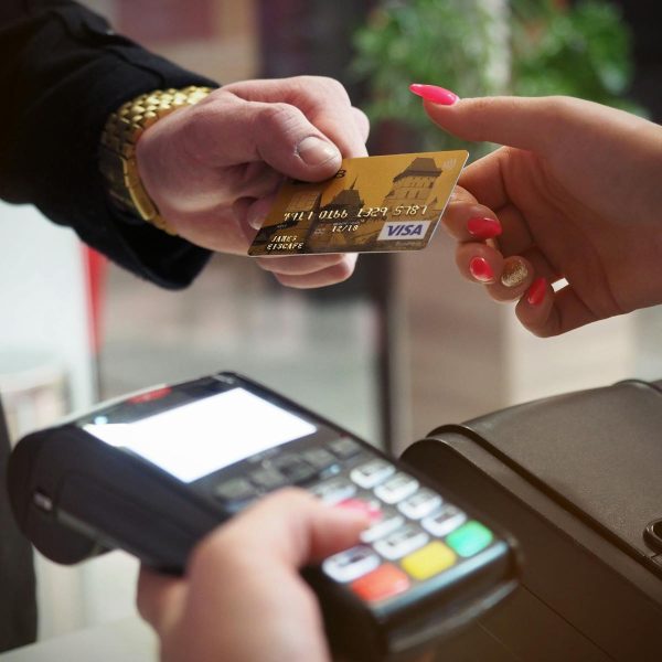 Close-up of a credit card payment being processed at a POS terminal.